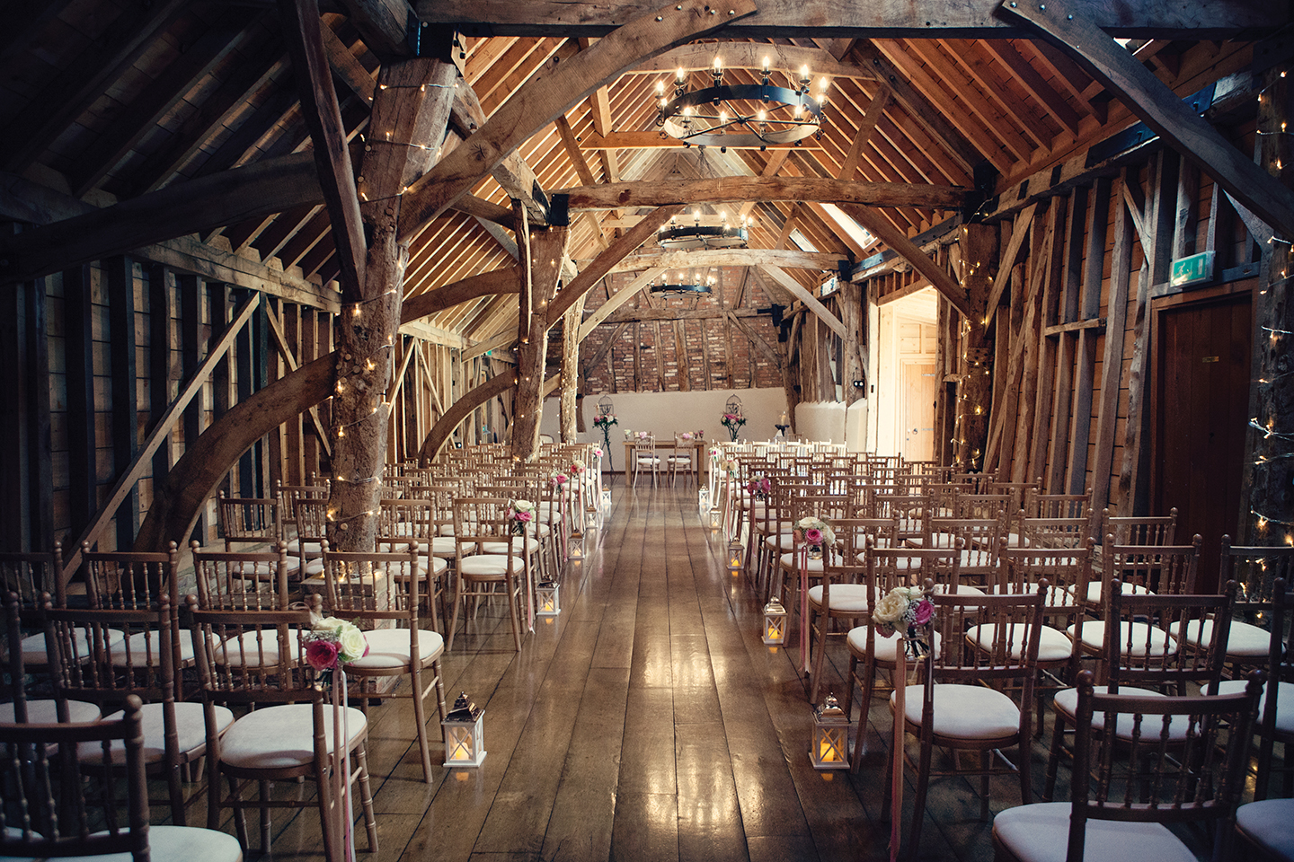 The Rickety Barn at Bassmead Manor Barns wedding venue is set up for a rustic wedding ceremony