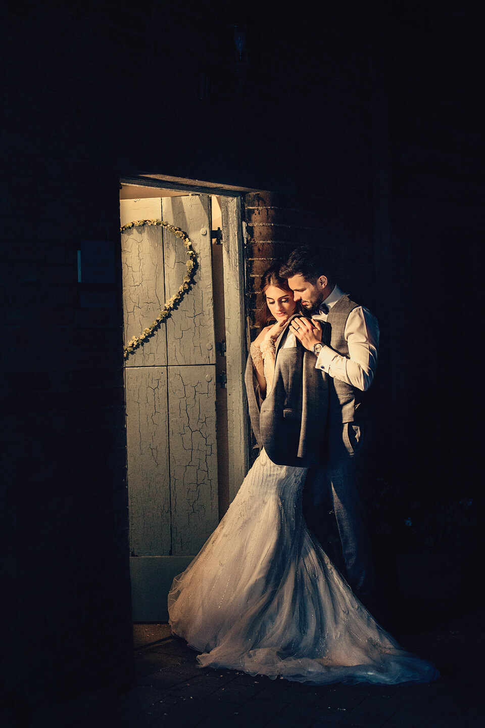 A bride and groom take a moment away from guests on their winter wedding day at Bassmead Manor Barns