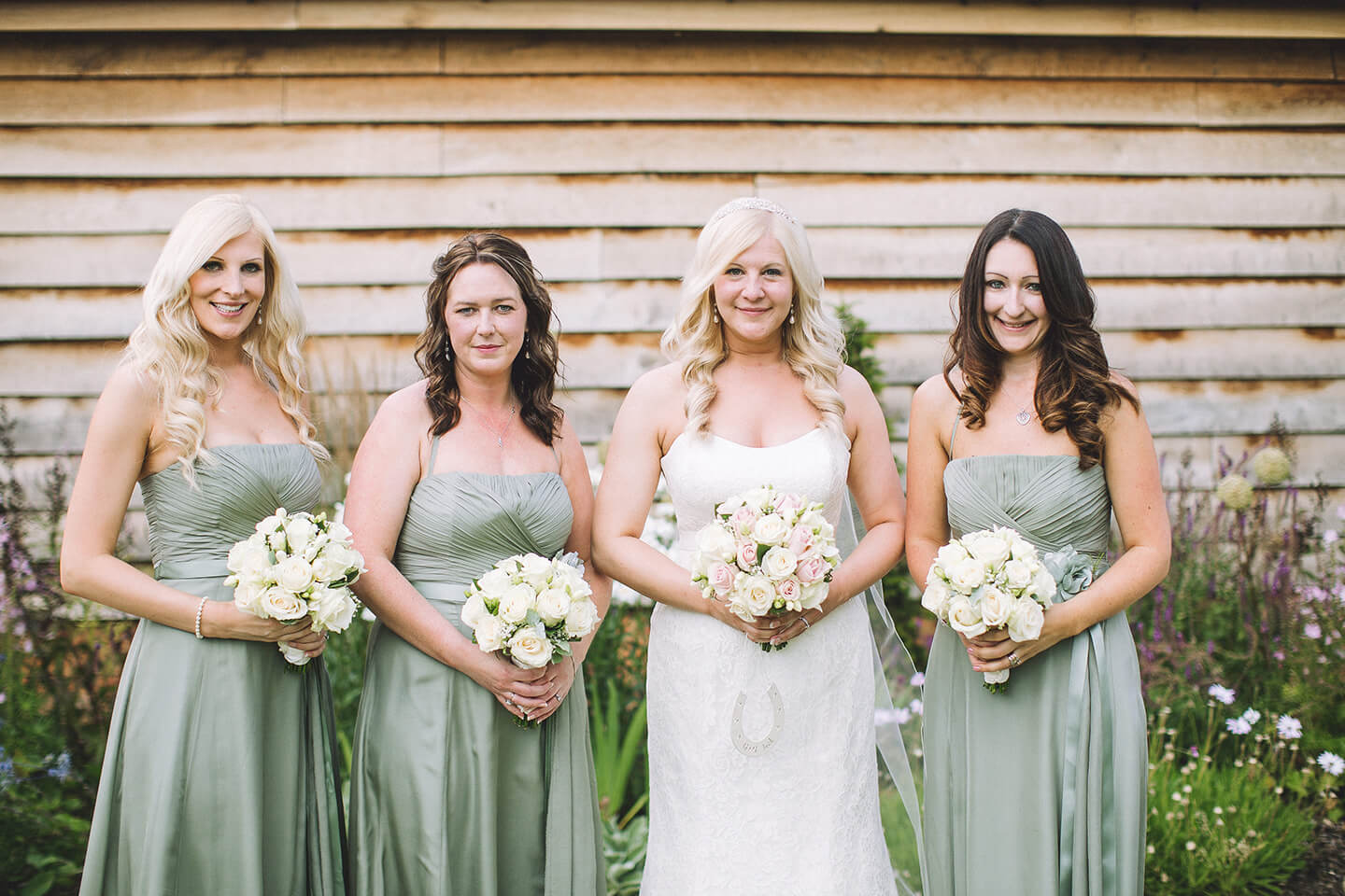 The three bridesmaids wore sage green bridesmaid dresses