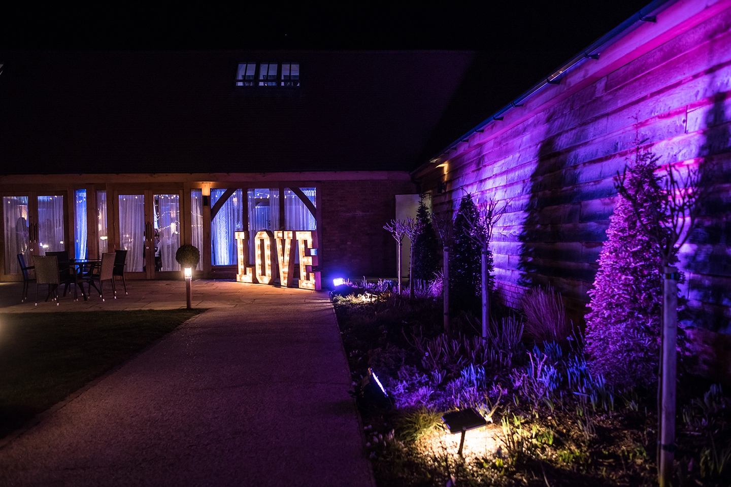 Giant love letters light up the gardens at Bassmead Manor Barns during a tasting event