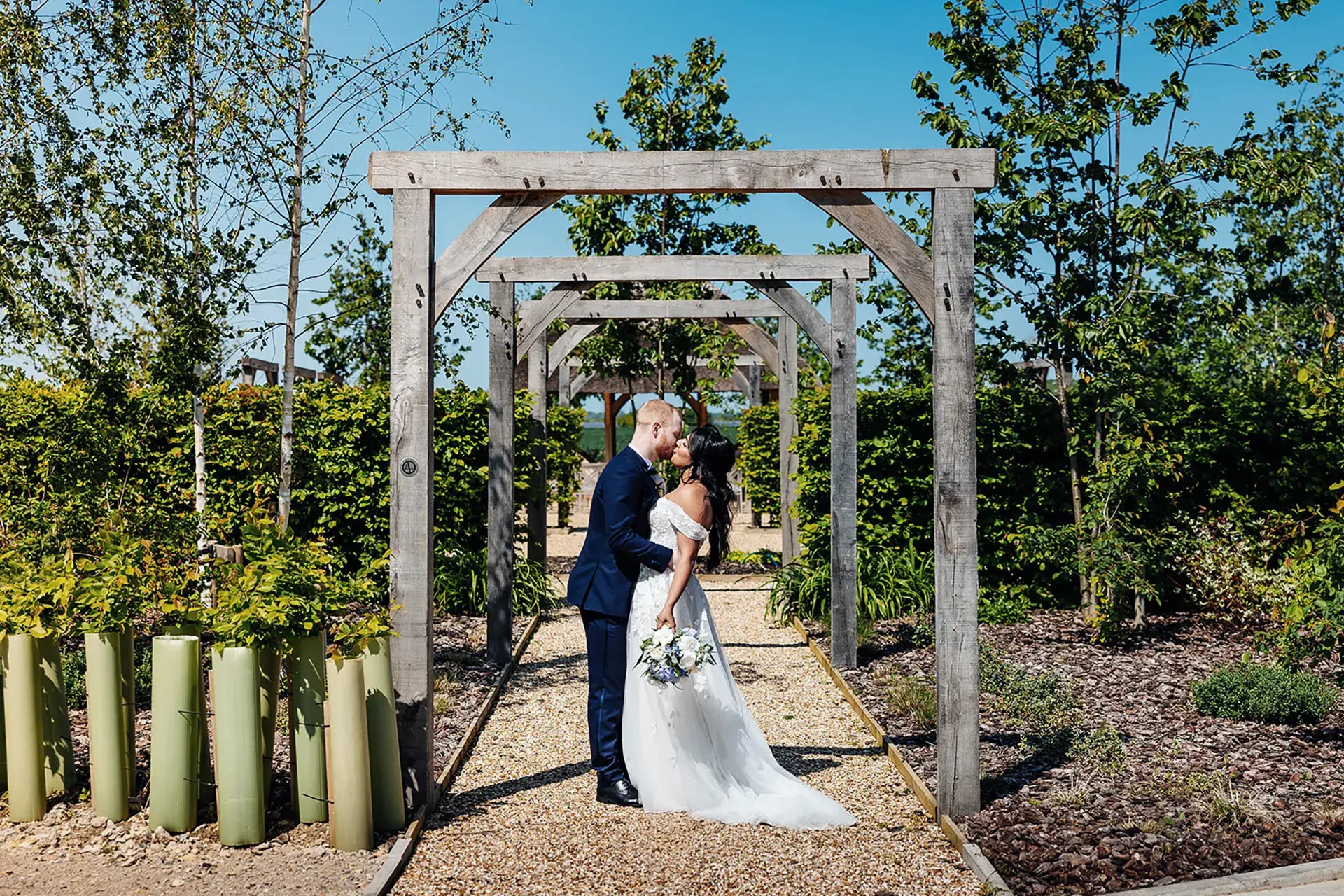 bassmead manor barns outdoor ceremony kiss